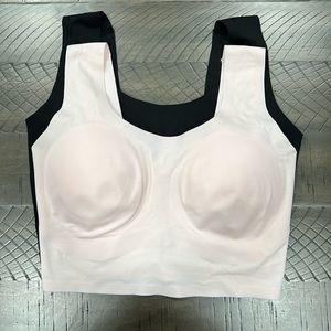 Pair of two new True Body scoop neck bra. Size XS . Pink and black